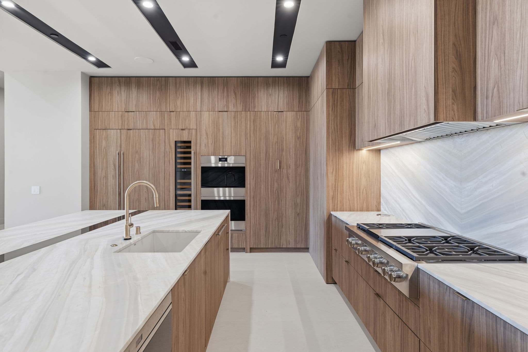 Modern luxury residence with contemporary architecture, open-concept living spaces, high-end finishes, expansive windows, and seamless indoor-outdoor design set against scenic desert mountain views.