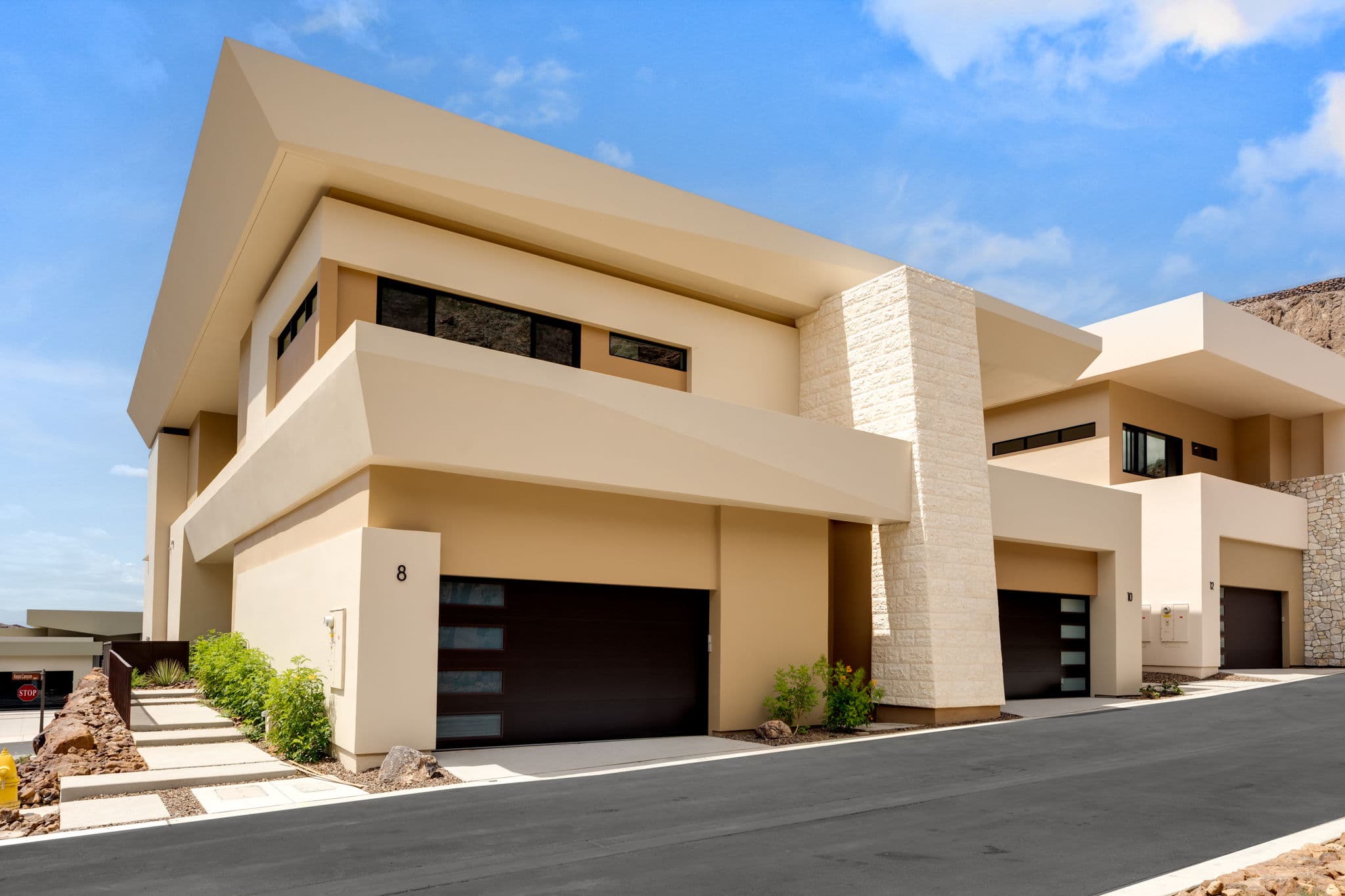 Modern luxury residence with contemporary architecture, open-concept living spaces, high-end finishes, expansive windows, and seamless indoor-outdoor design set against scenic desert mountain views.