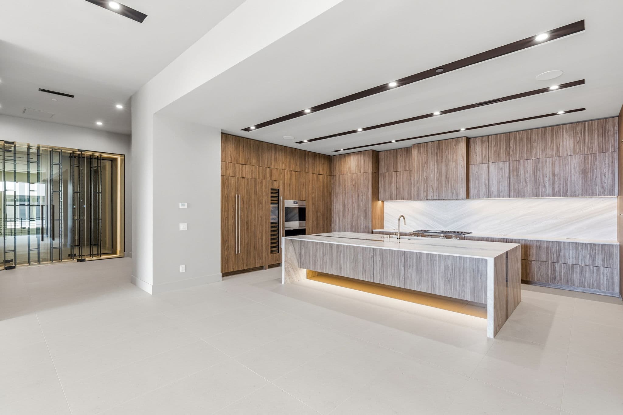 Modern luxury residence with contemporary architecture, open-concept living spaces, high-end finishes, expansive windows, and seamless indoor-outdoor design set against scenic desert mountain views.