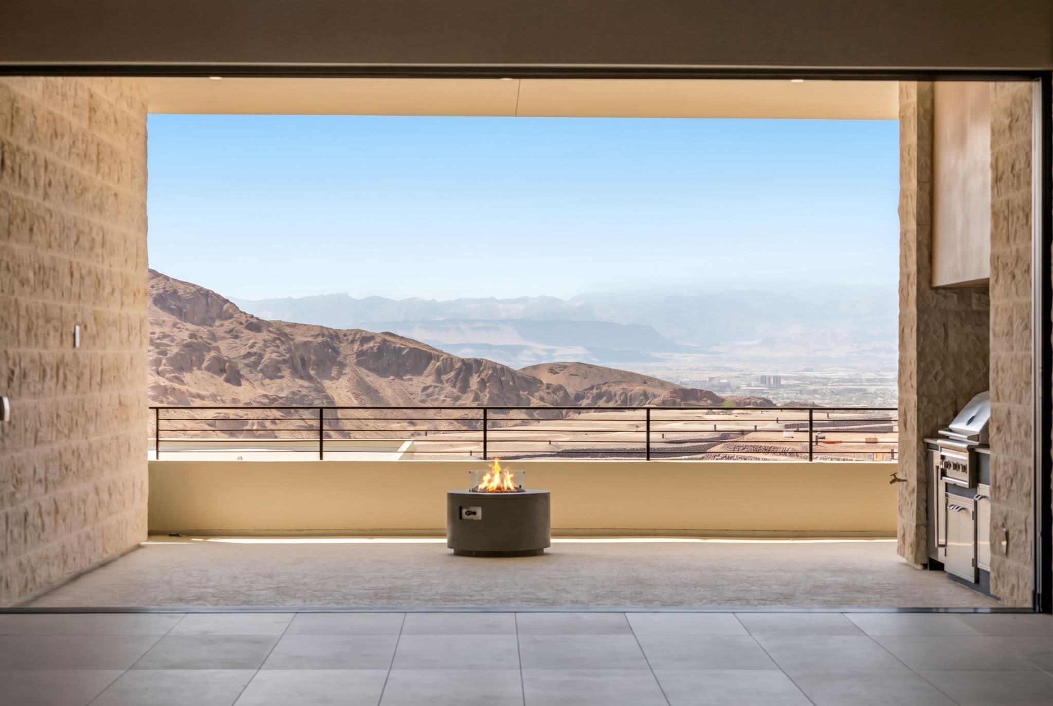 Modern luxury residence with contemporary architecture, open-concept living spaces, high-end finishes, expansive windows, and seamless indoor-outdoor design set against scenic desert mountain views.
