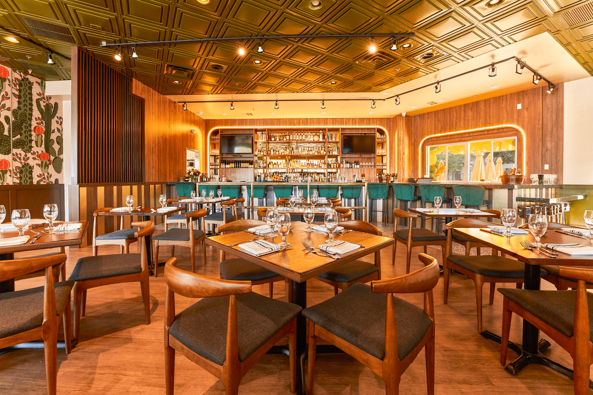 Upscale restaurant interior with warm lighting and modern design.