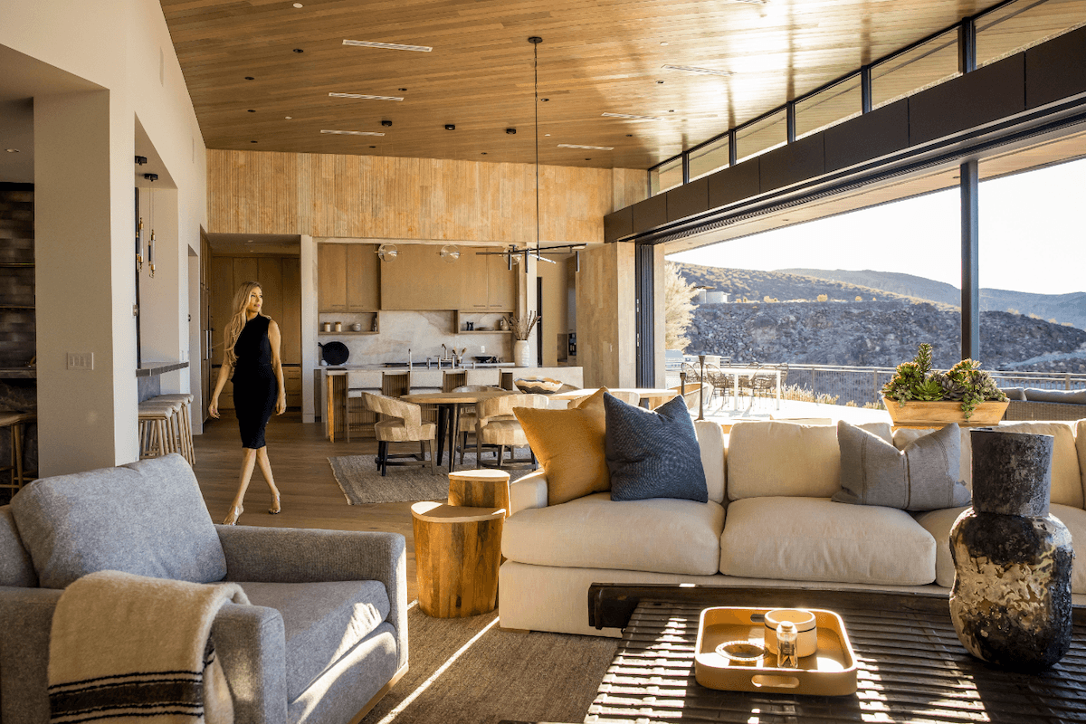Modern open-concept living space with indoor-outdoor design and desert views.